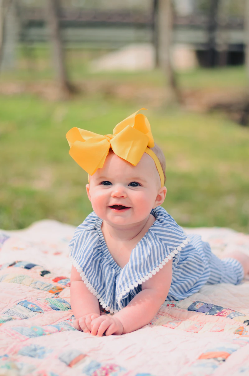 Smiling baby lying on soft textile