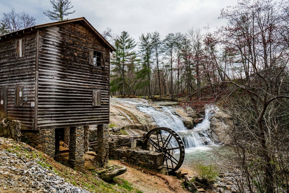 brown house near body of water