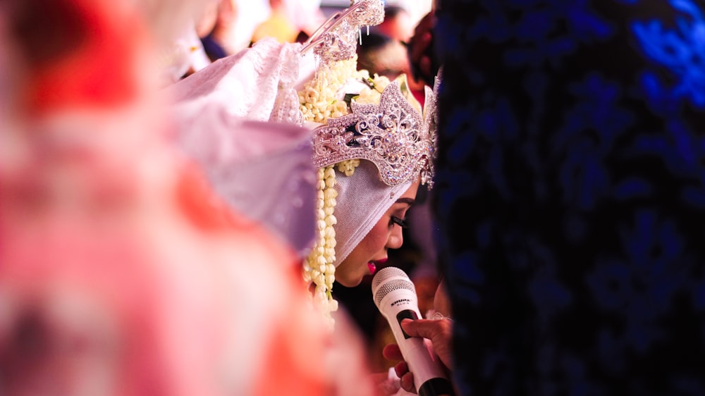 woman talking while using microphone