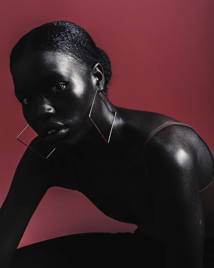 Woman with radiant skin and elegant jewellery after a gold facial