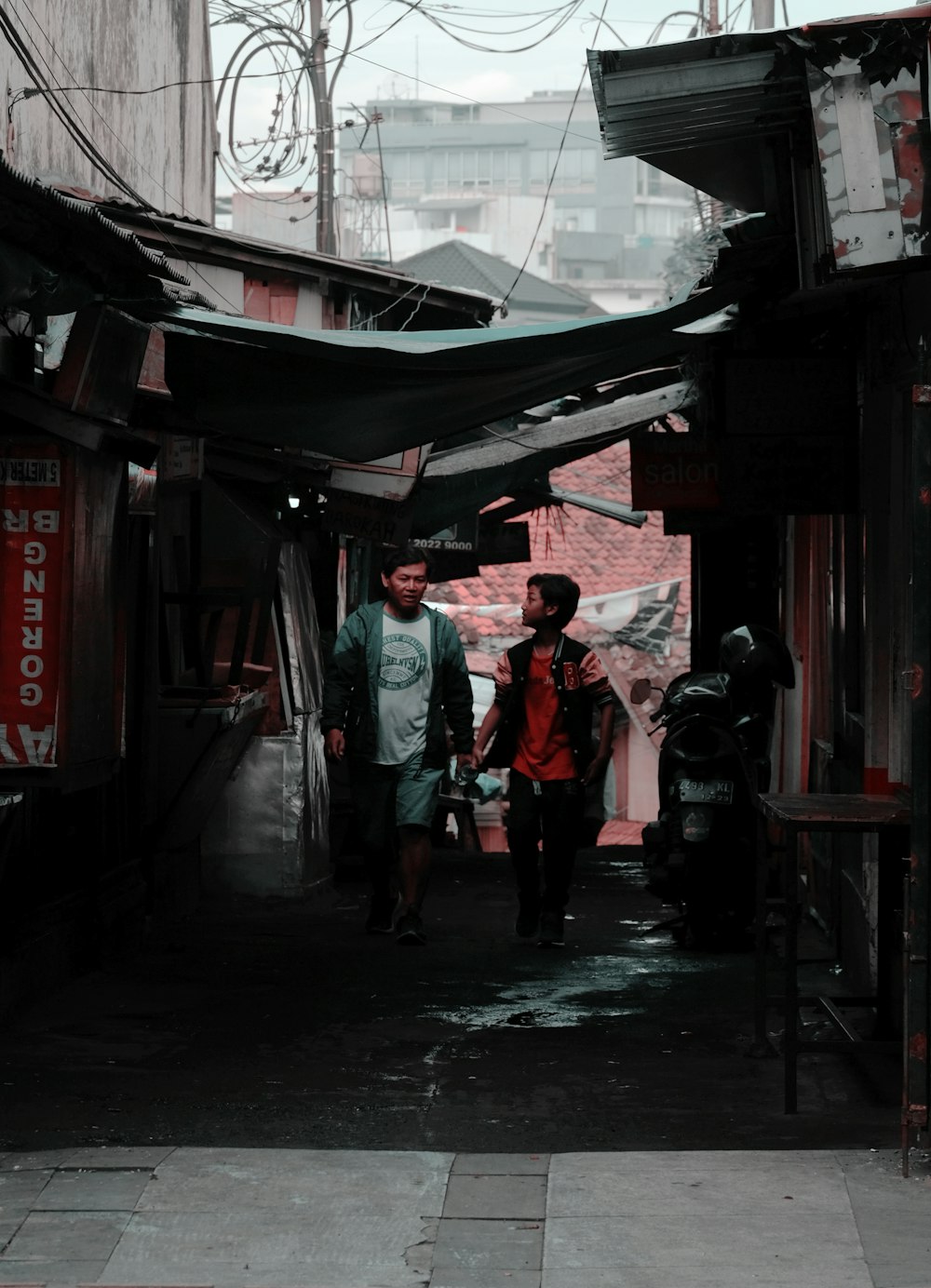 two man walking on alley