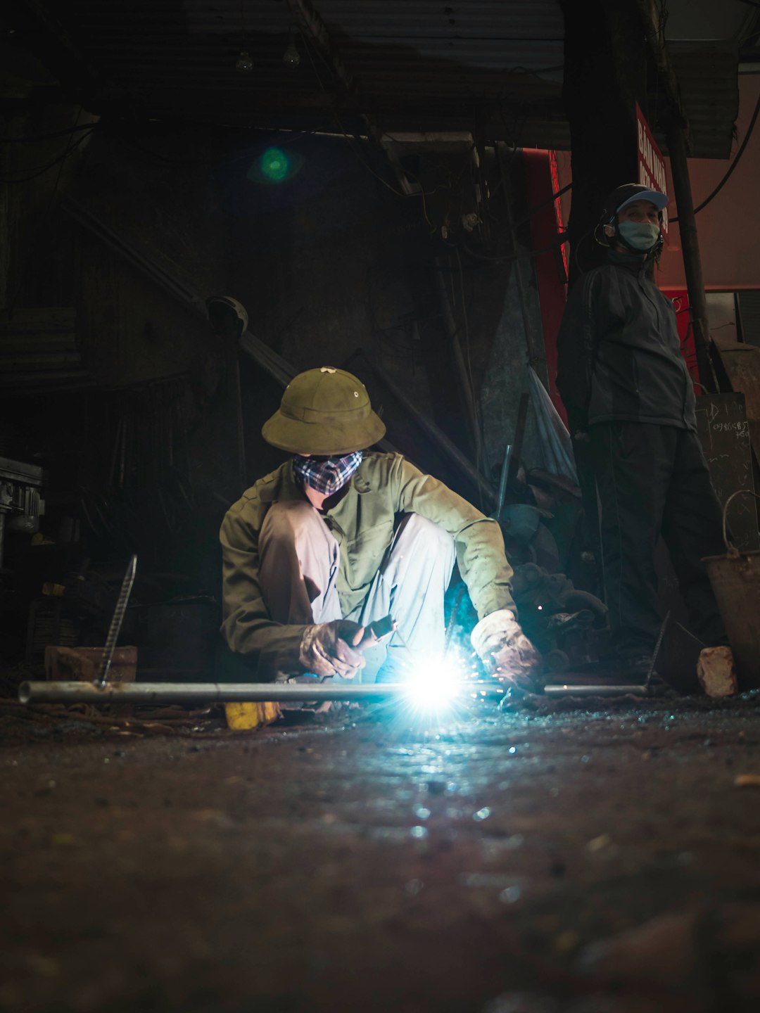 man welding the rod bar