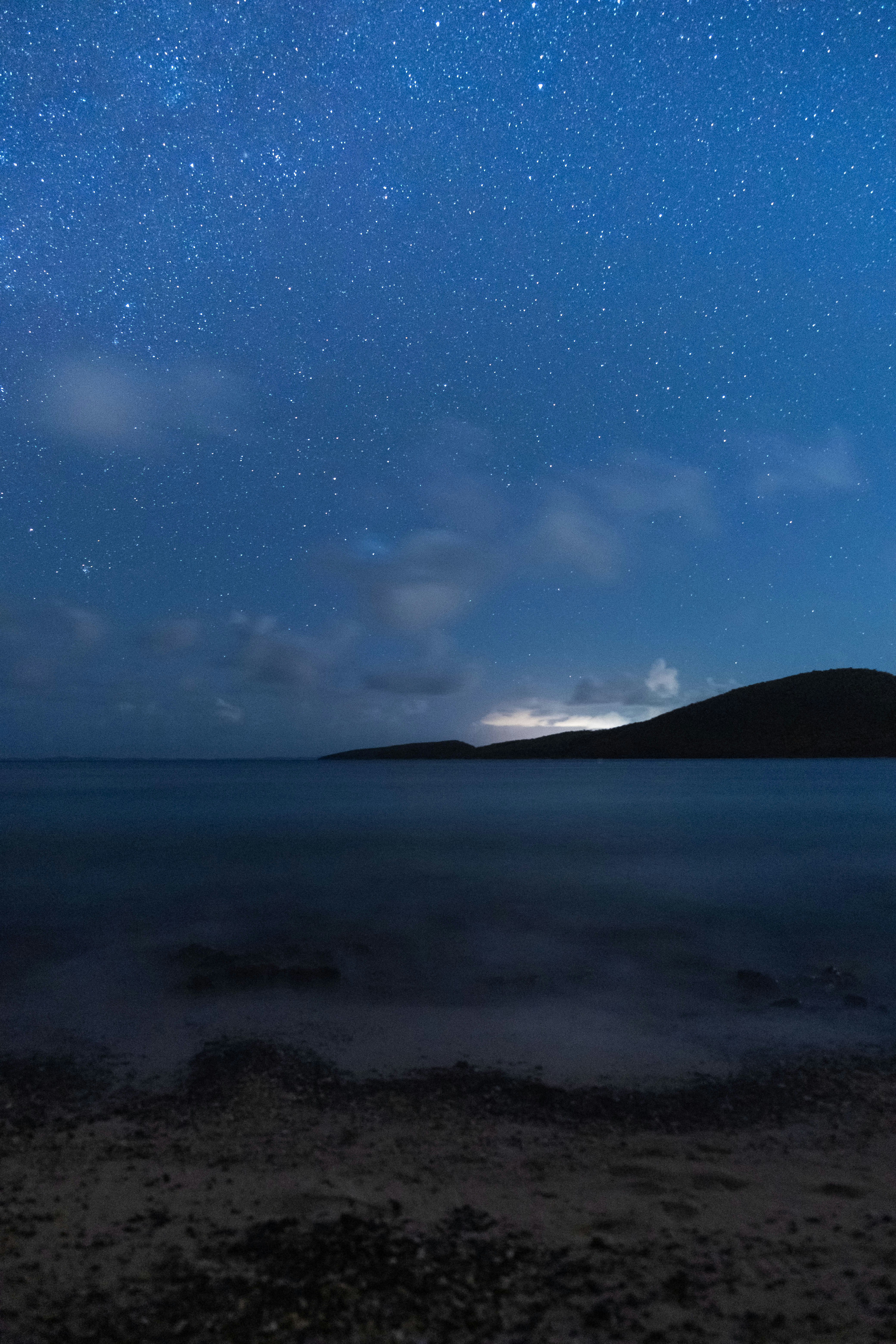 shore and mountain at night