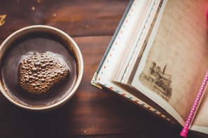 A serene study environment with a cup of coffee and a notebook.