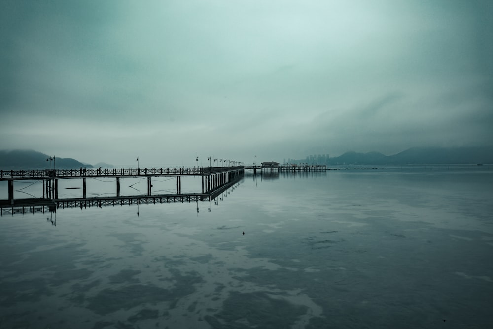 body of water under cloudy sky