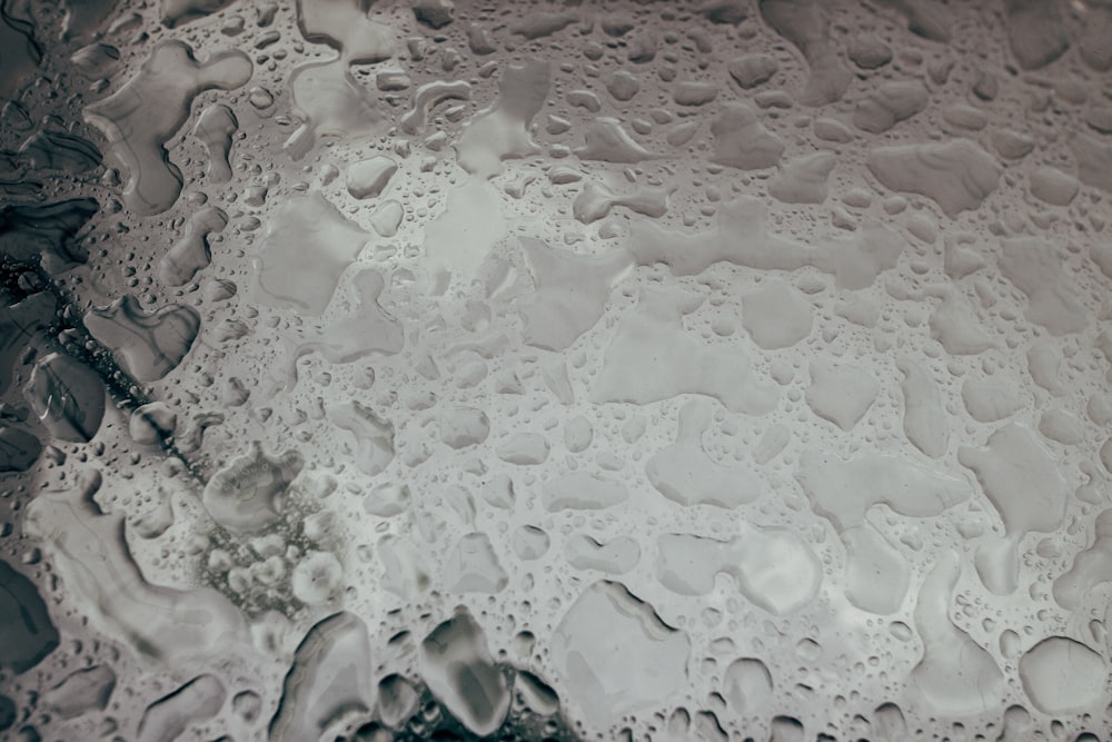 a close up of water droplets on a surface