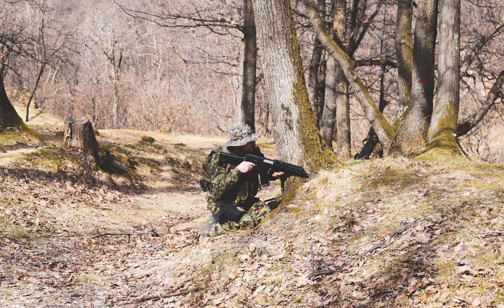 person holding assault rifle