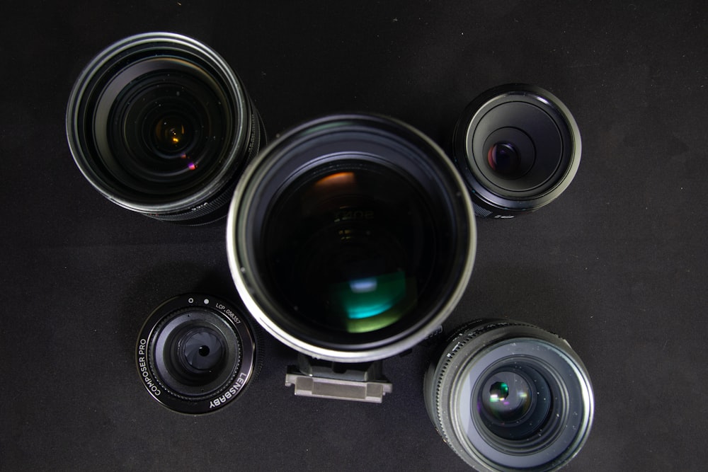 camera lenses on black surface