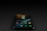 A smartphone displaying various app icons on its screen is placed on a dark surface. The screen is active, showcasing applications like Instagram, Snapchat, and Spotify. The environment is dimly lit, accentuating the glow of the phone screen.