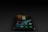 A smartphone displaying various app icons on its screen is placed on a dark surface. The screen is active, showcasing applications like Instagram, Snapchat, and Spotify. The environment is dimly lit, accentuating the glow of the phone screen.