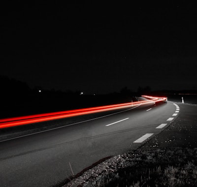 time-lapse photography of gray concrete road during nighttime