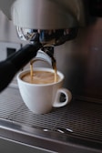 white ceramic mug with coffee