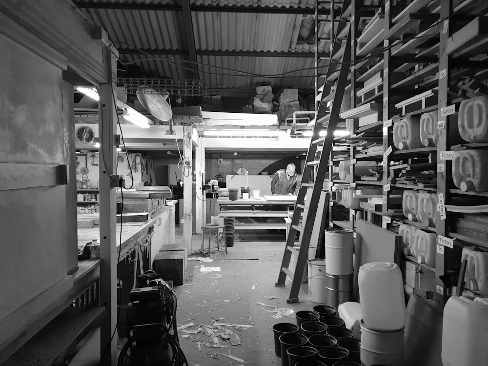 grayscale photography of room with shelves