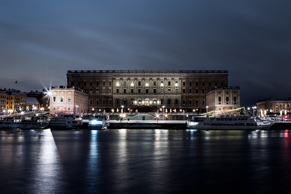 lighted building beside sea