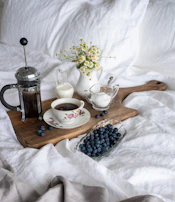 An inviting breakfast scene with a French press coffee maker and freshly baked pastries.