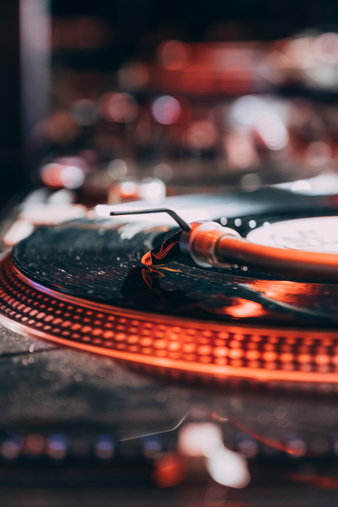 selective focus photo of vinyl disc player with bokeh lights