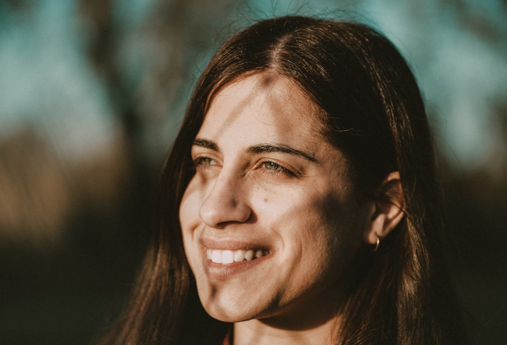 selective focus photography of smiling woman