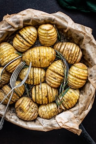 forks on steamed and sliced potatoes
