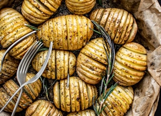 forks on steamed and sliced potatoes