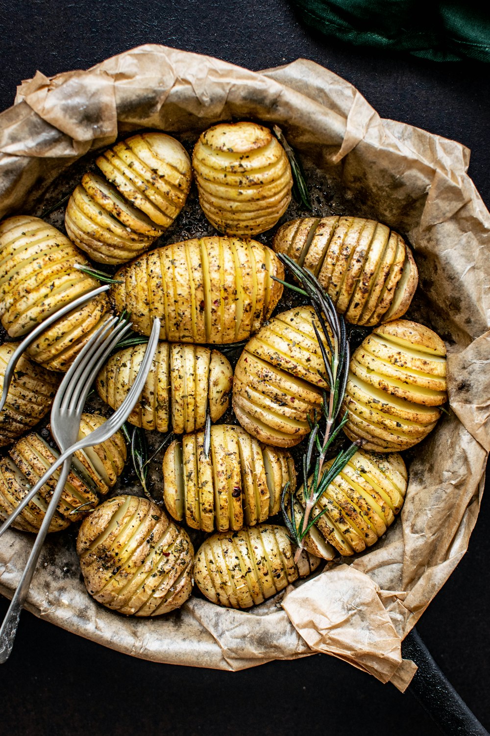 forks on steamed and sliced potatoes