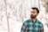 man standing near wood s