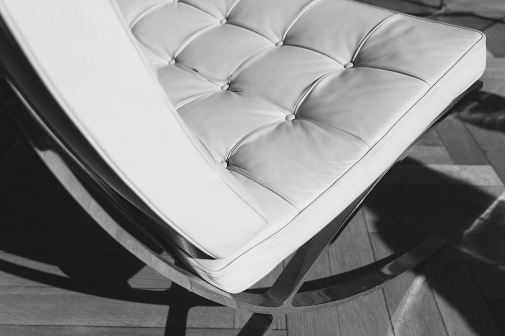 tufted white padded gray metal chair