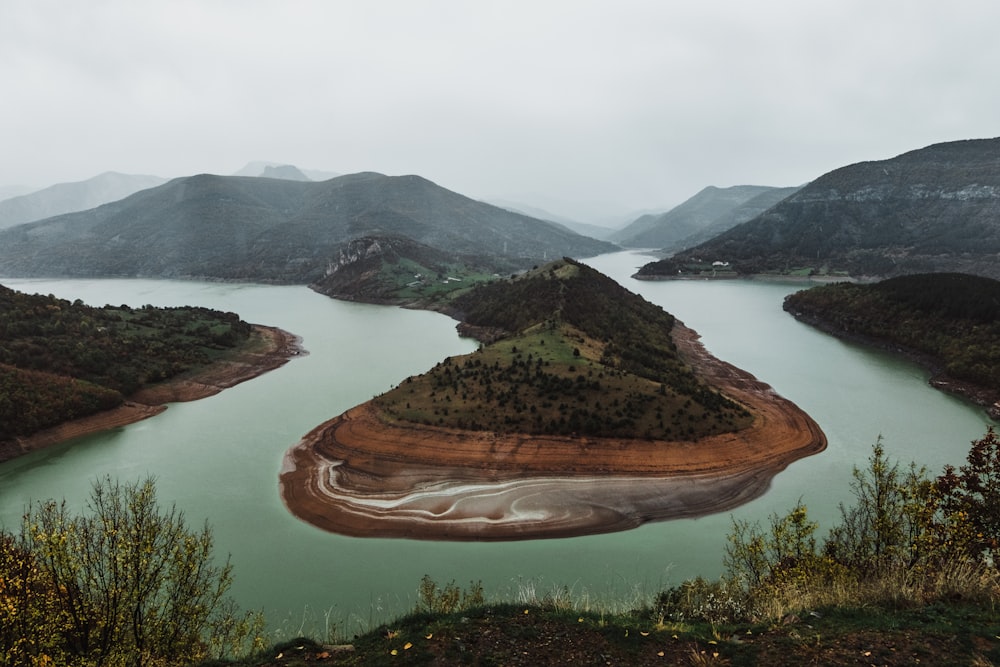 mountain near body of water during daytime