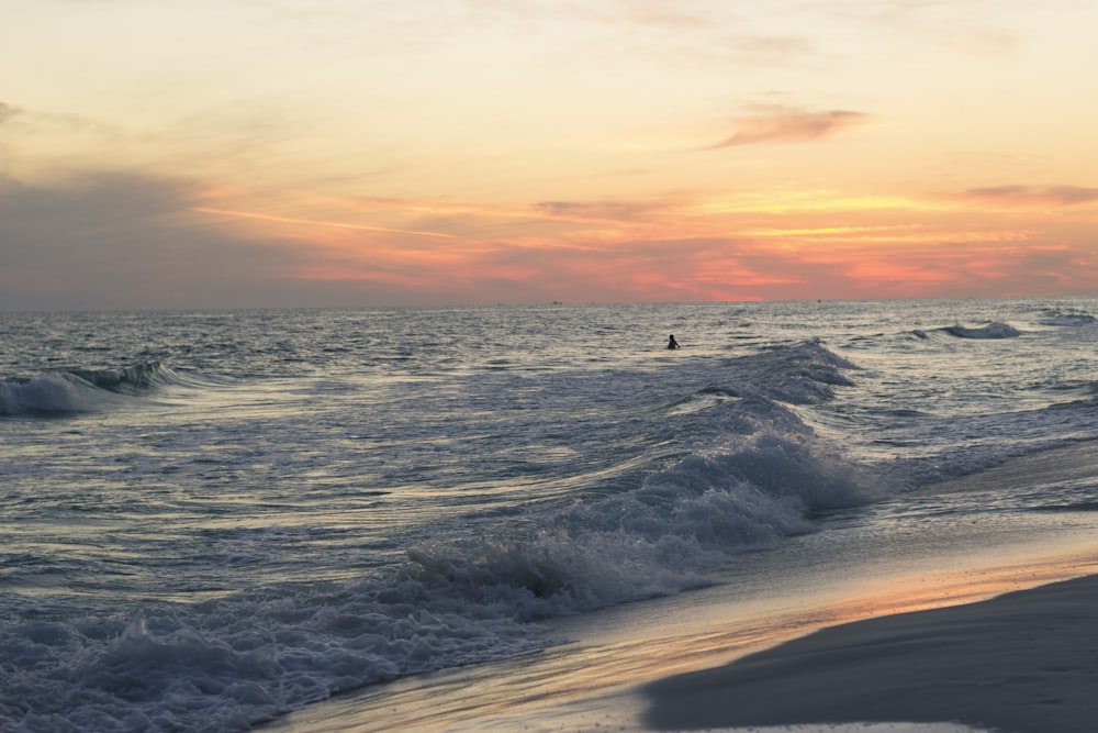 sea waves under clear blue sky