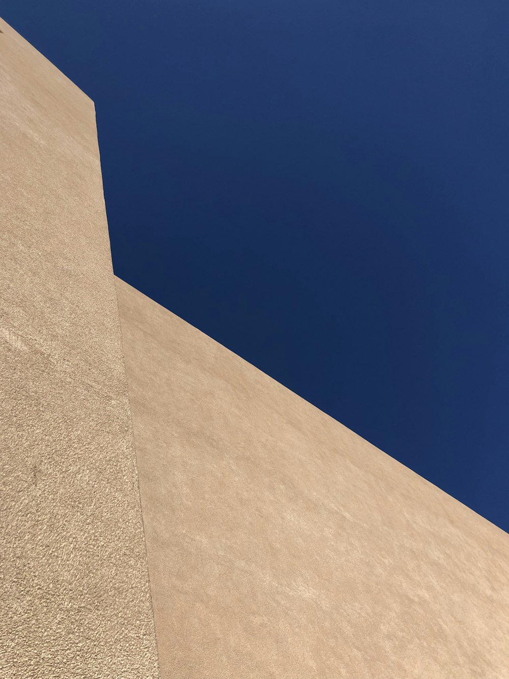 low-angle photography of brown concrete building