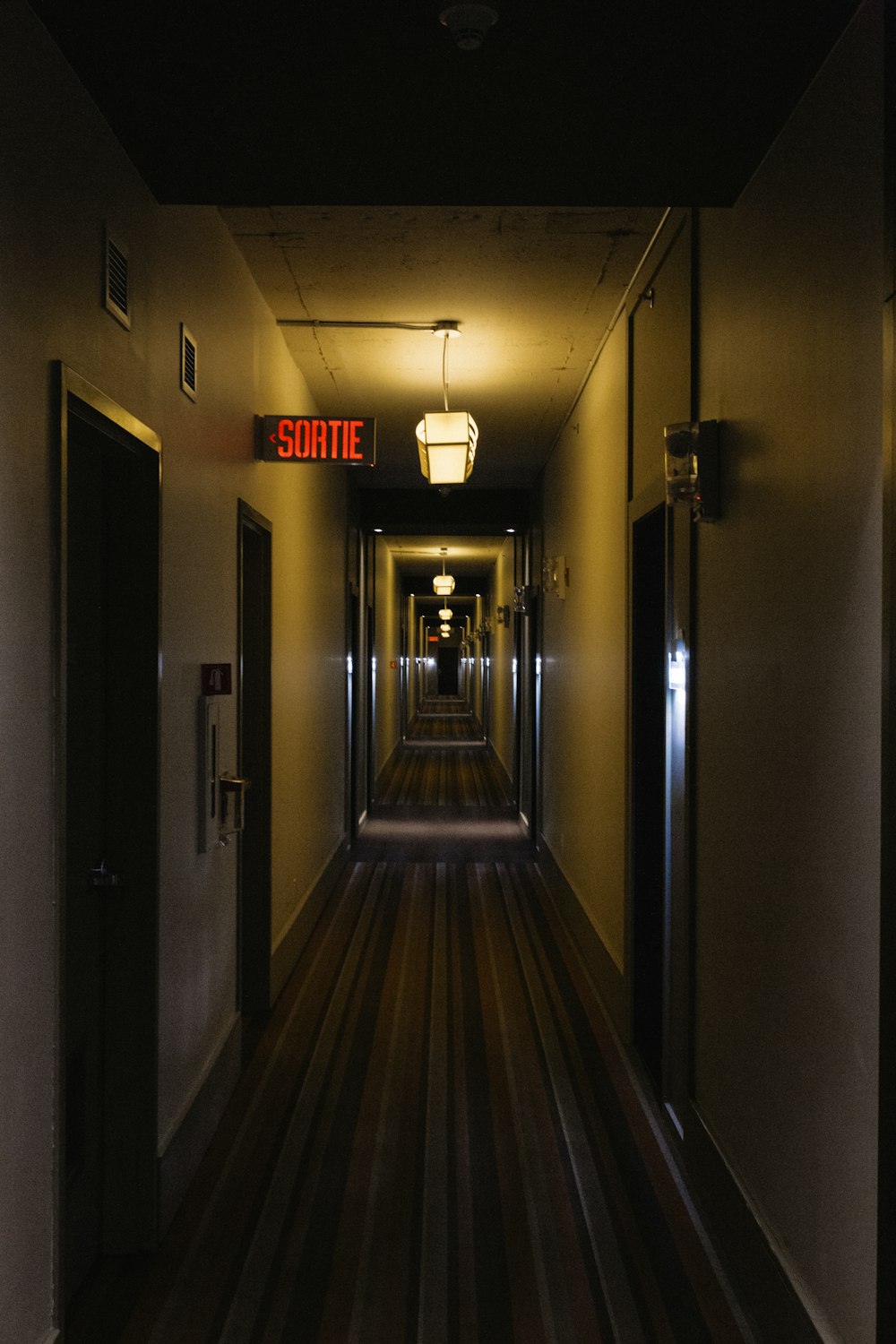 gray and brown wooden hallway