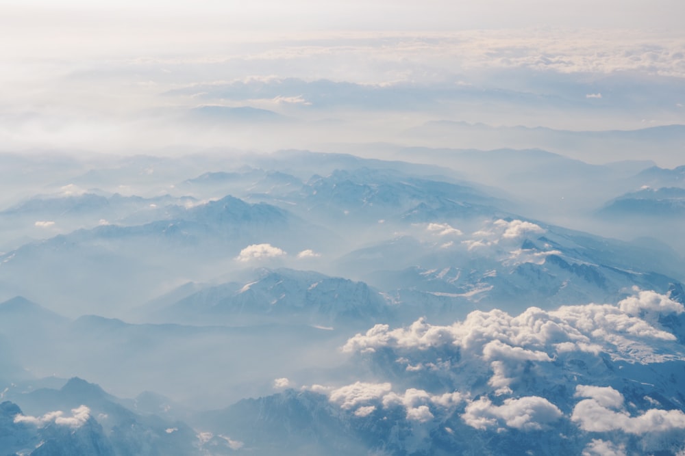 view of mountaintops with clouds