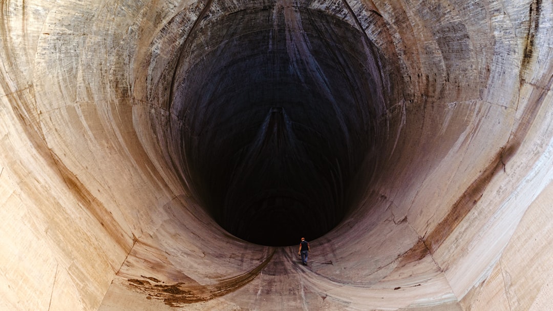 man inside tunnel during daytime