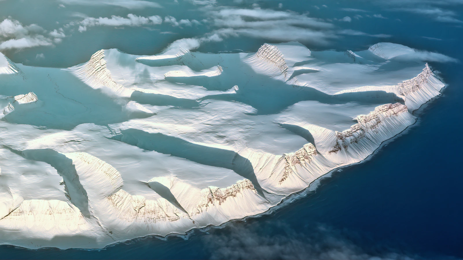 Illustrative aerial photograph of a glacier and mountain landscape