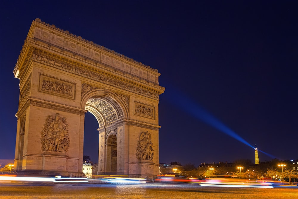 time lapse photography of Arch de Triumph at night