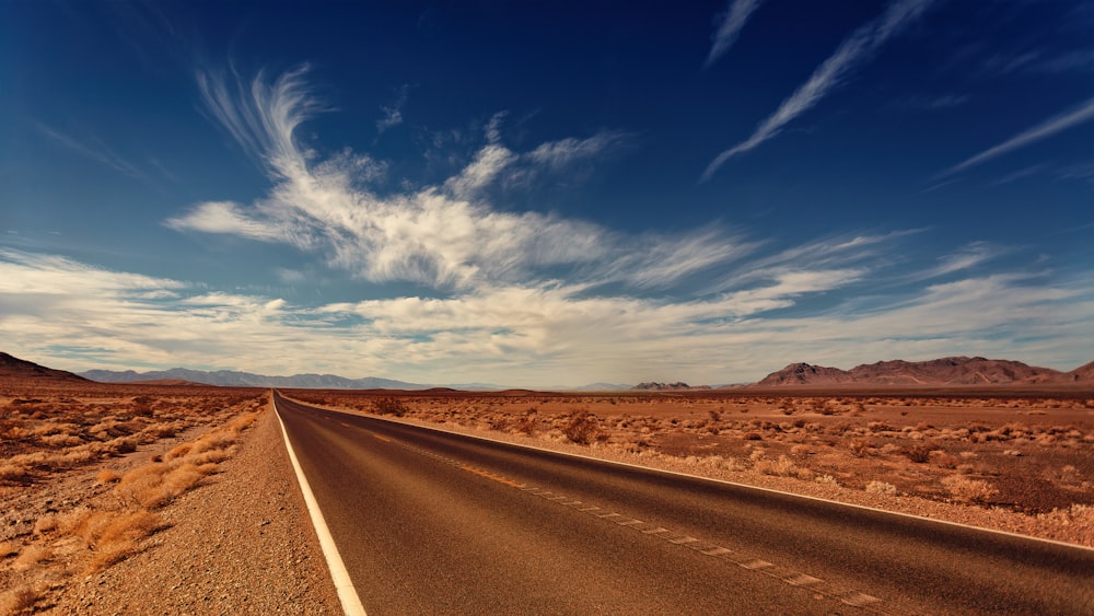 brown concrete road during daytie