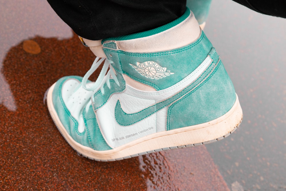 person wearing white blue and orange nike air jordan 1 shoes photo – Free  Footwear Image on Unsplash