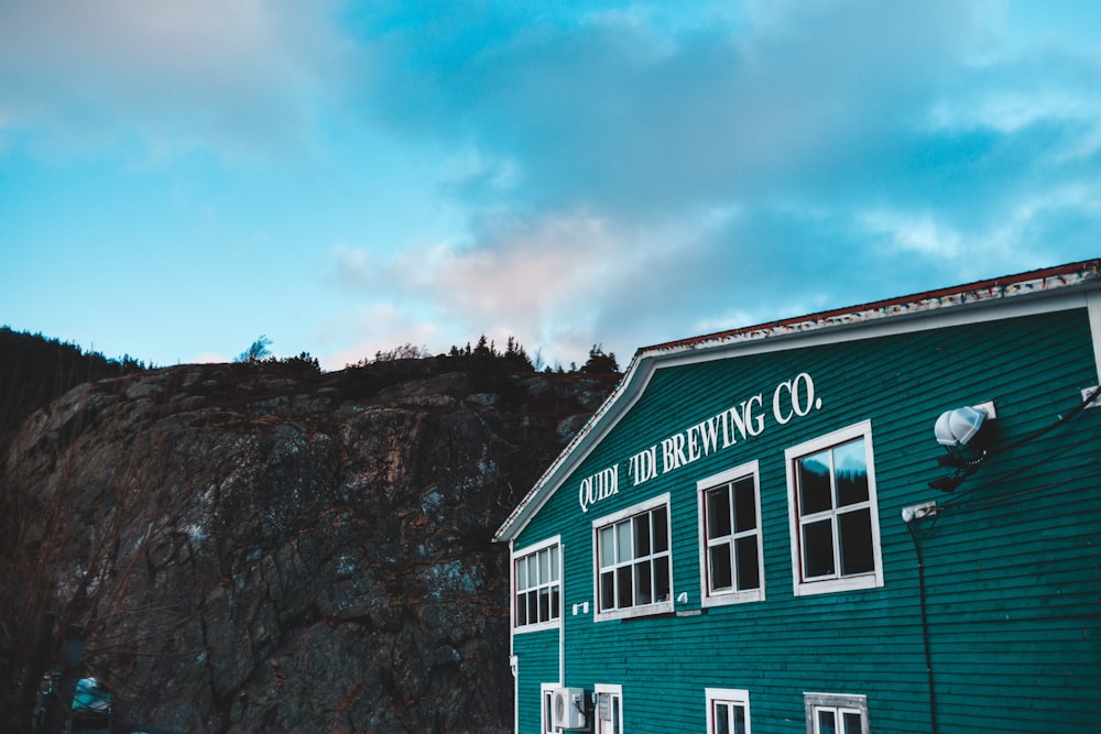 green wooden building during daytime