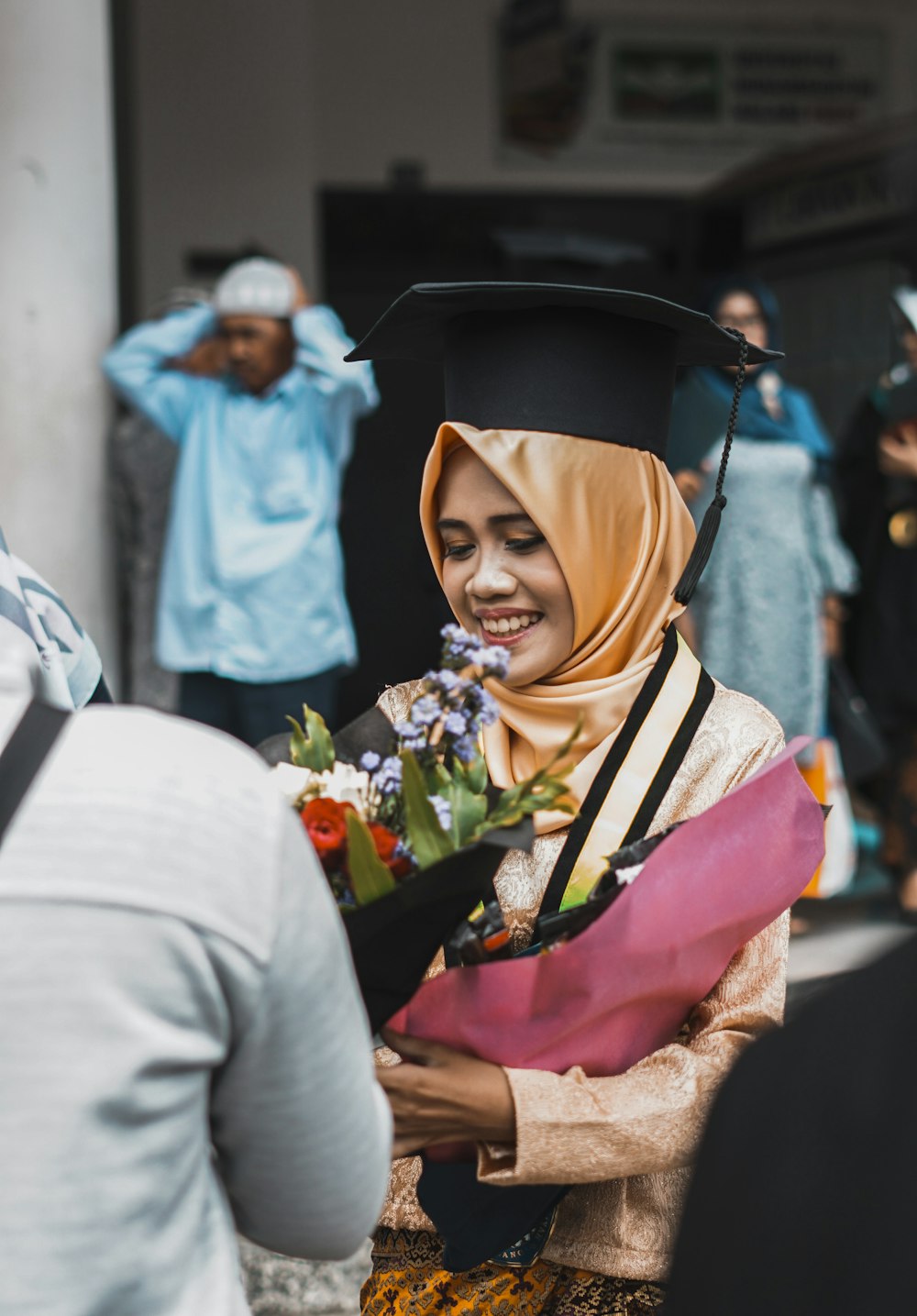 woman receiving bouquet of flowers