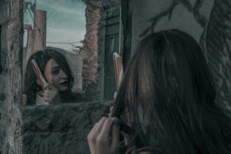 woman combing her hair