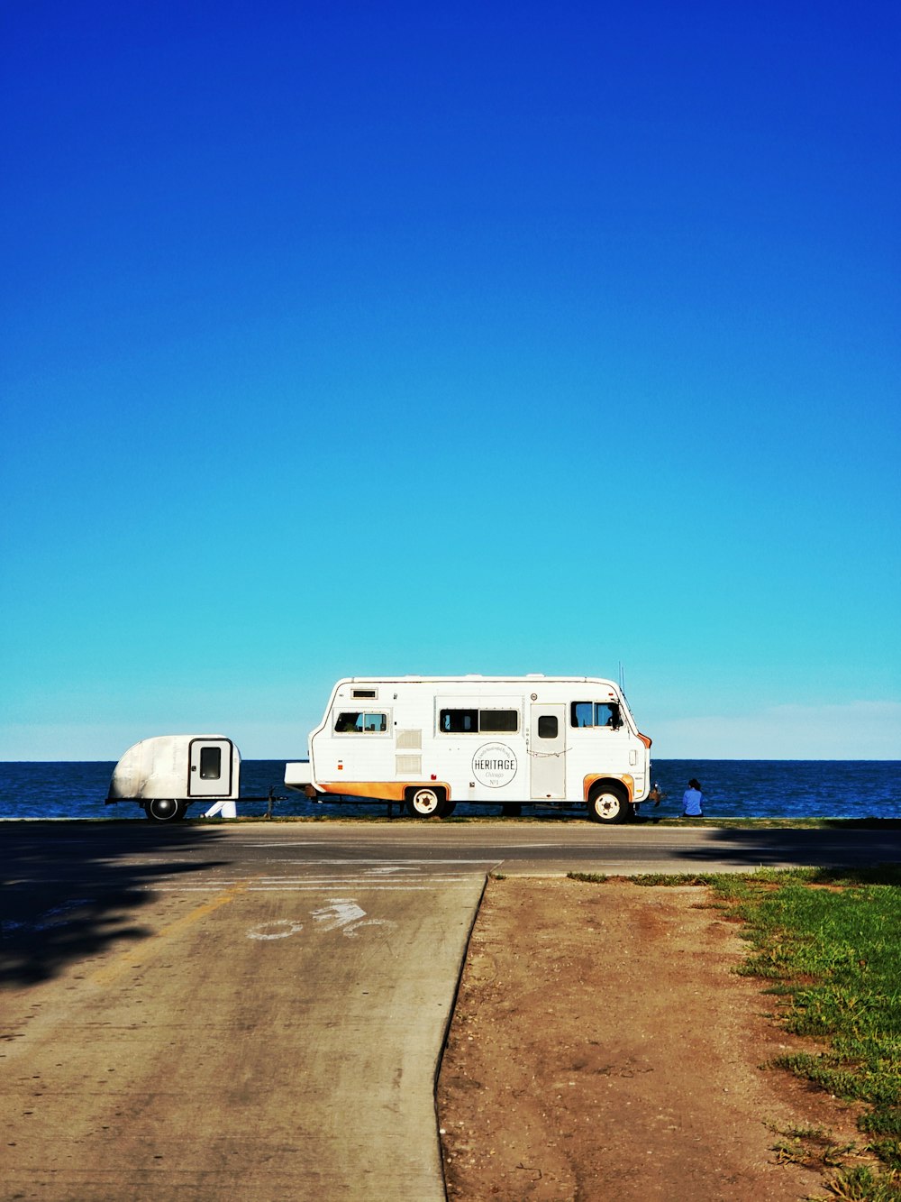 view of a white RV on a roadside