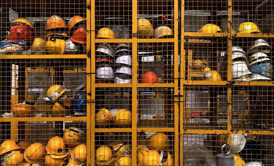 a rack filled with lots of yellow hard hats