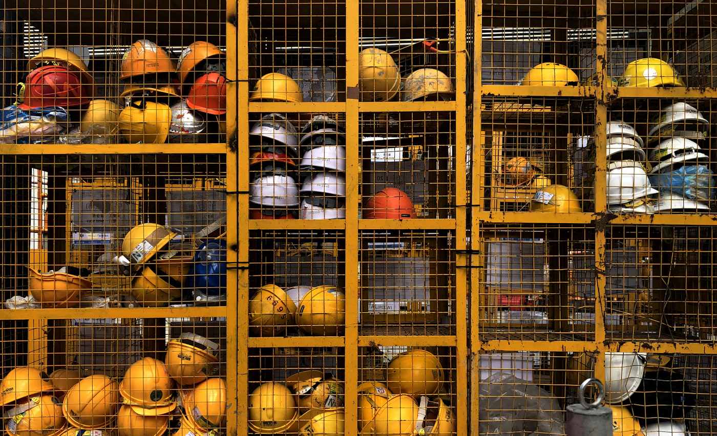 Rack of safety helmets used in hazardous goods handling