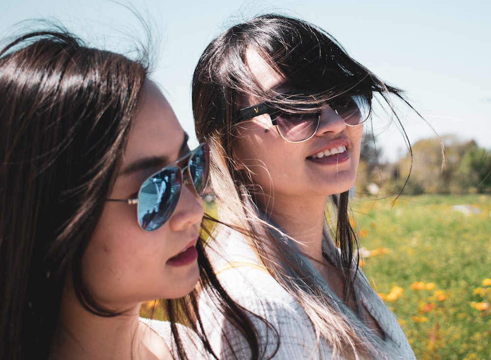 two women wearing shades