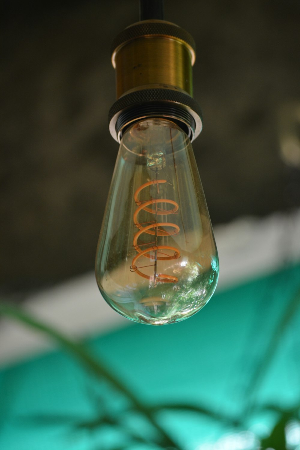 focus photography of clear glass bulb