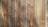Four wooden planks with visible grain patterns and knots, characterized by a natural brown color and varied texture.