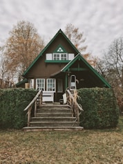 brown and green painted house