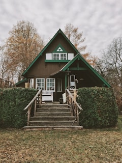 brown and green painted house