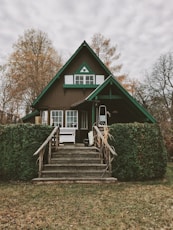 brown and green painted house