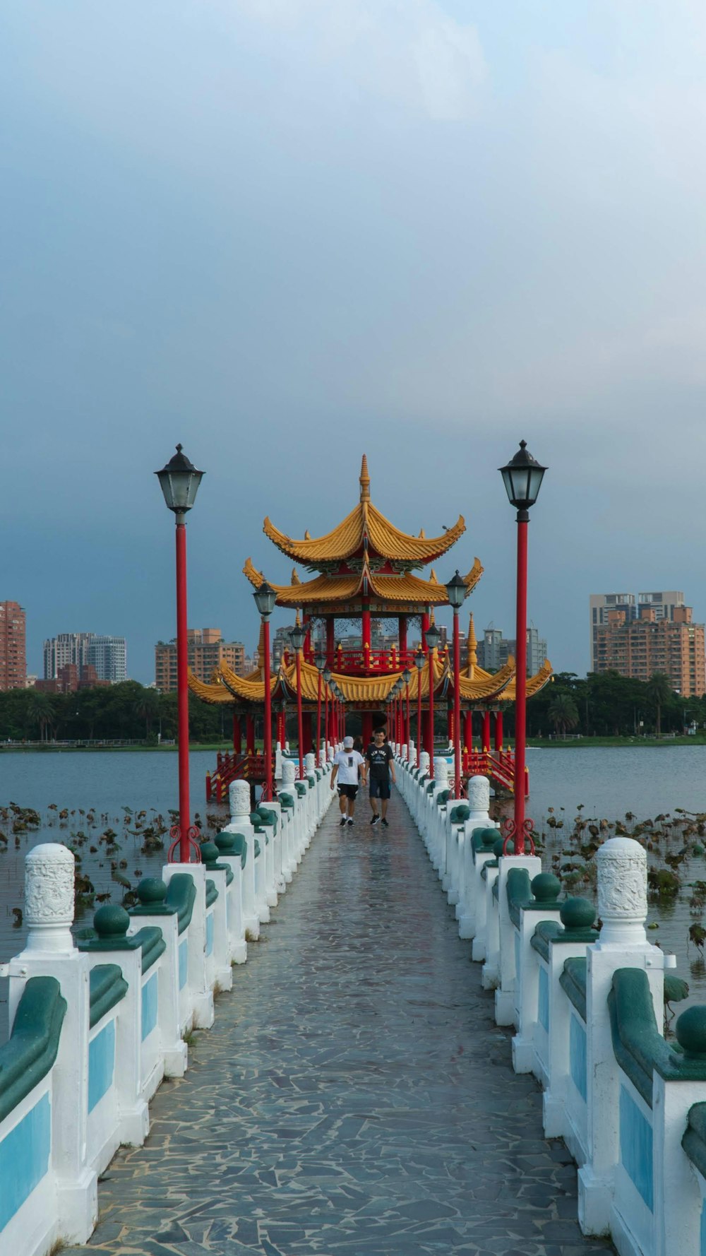 two men walking on concrete dock