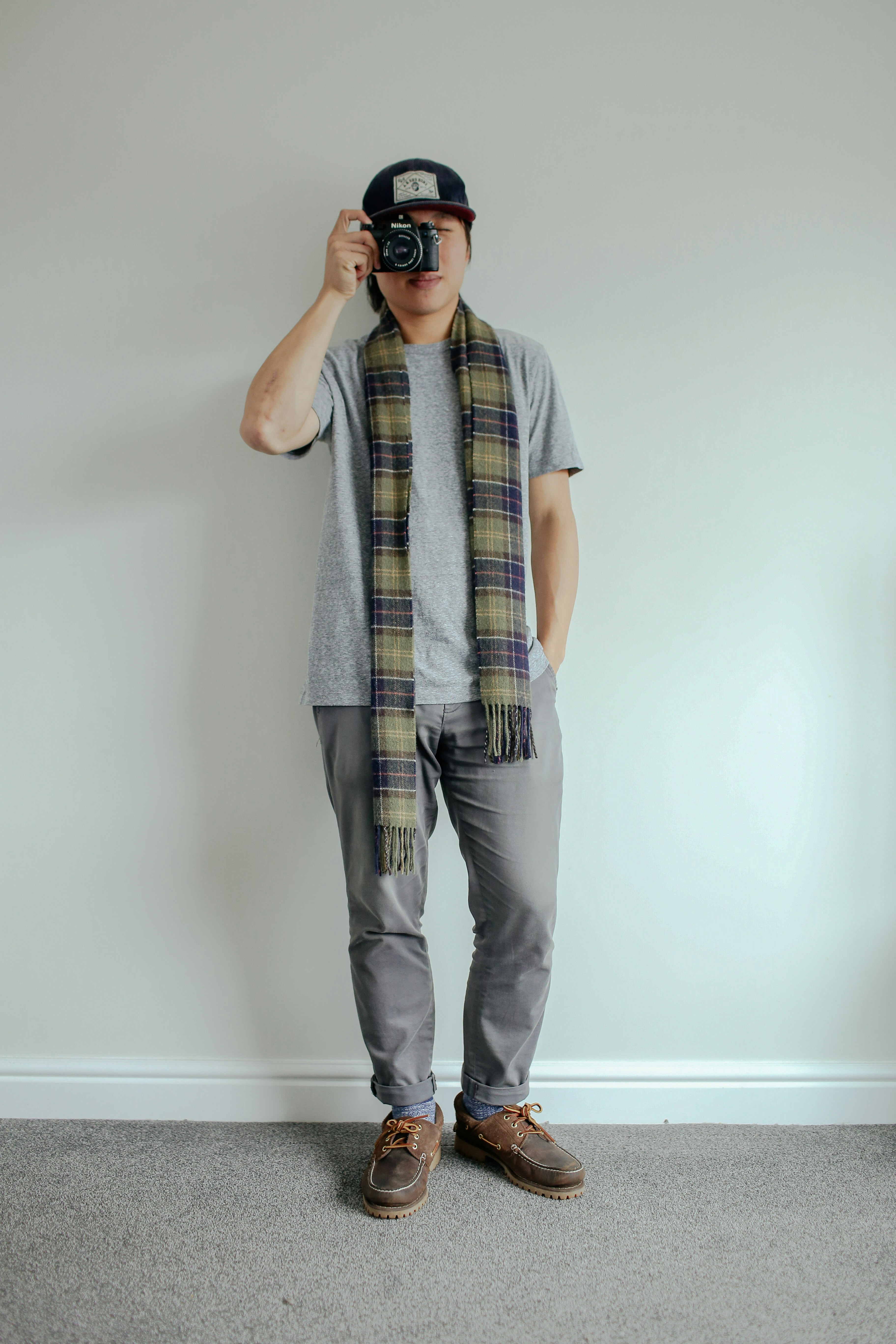 How to Mix Patterns Like a Pro: Simple Tips for Bold Outfits – man using a camera